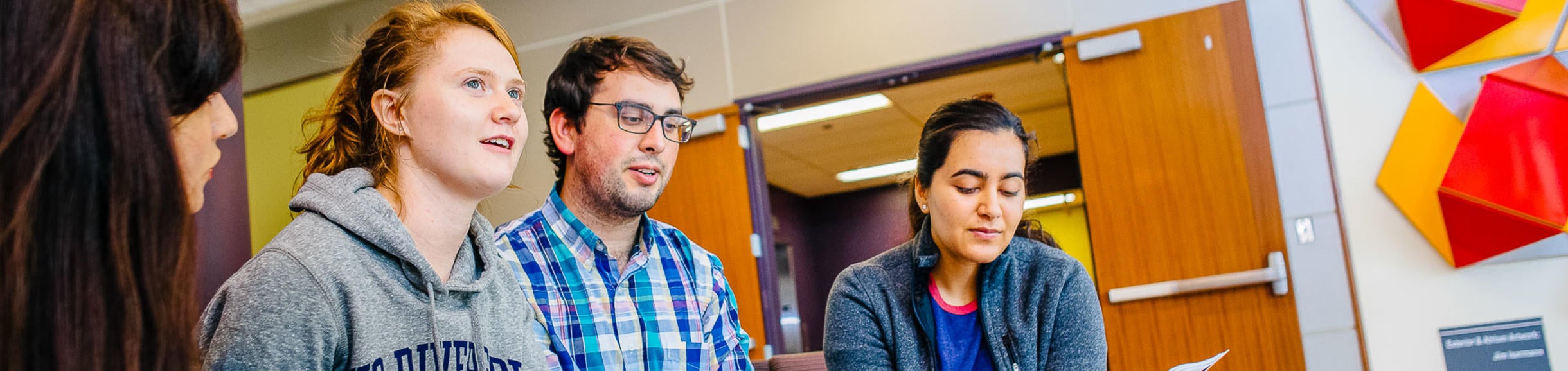 Four students gather in a UC Riverside classroom