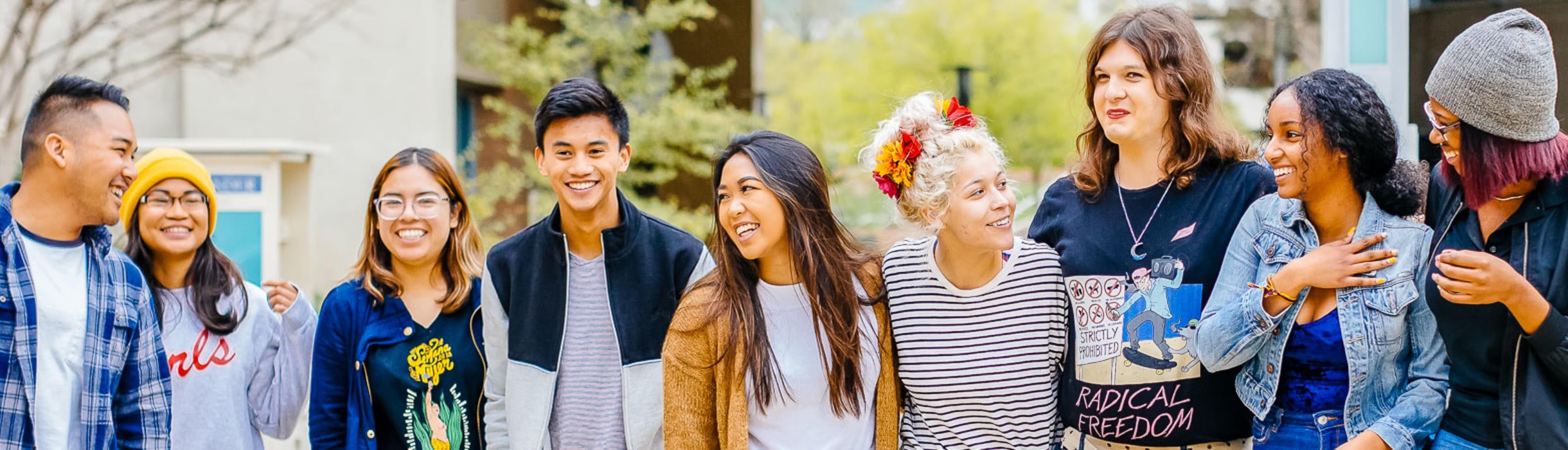 A group of students from a variety of countries gather on the UCR campus